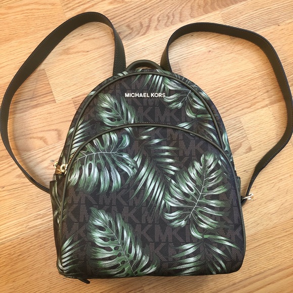 Michael Kors Handbags - MK Brown logo with palm design backpack.